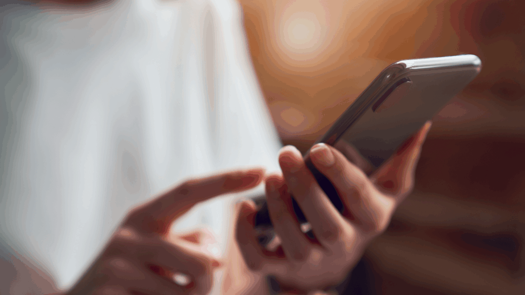 person using mobile phone to search for near me keywords 